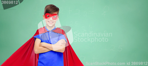 Image of boy in red super hero cape and mask