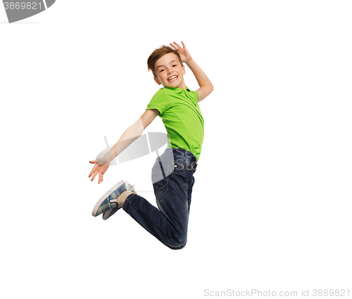 Image of smiling boy jumping in air