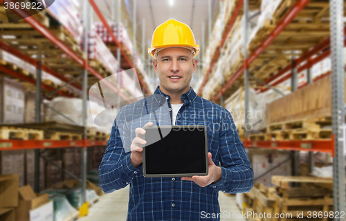 Image of happy businessman with tablet pc at warehouse