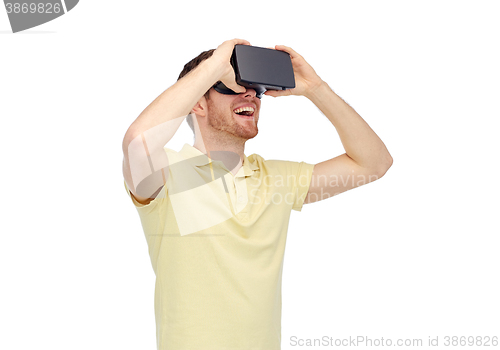 Image of happy man in virtual reality headset or 3d glasses