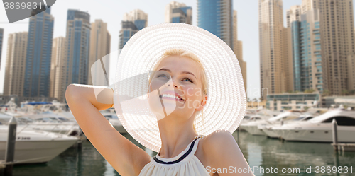 Image of happy woman enjoying summer over dubai city harbor