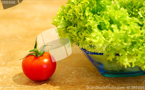 Image of Fresh salad and a  tomato
