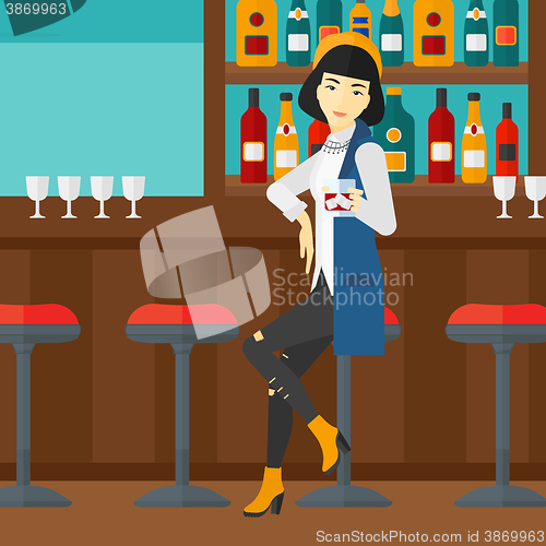 Image of Woman sitting at bar.