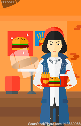 Image of Woman with fast food.