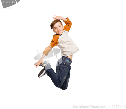 Image of happy smiling boy jumping in air