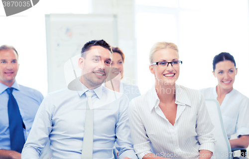 Image of businessmen and businesswomen on conference