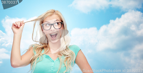 Image of happy young woman or teenage girl in glasses