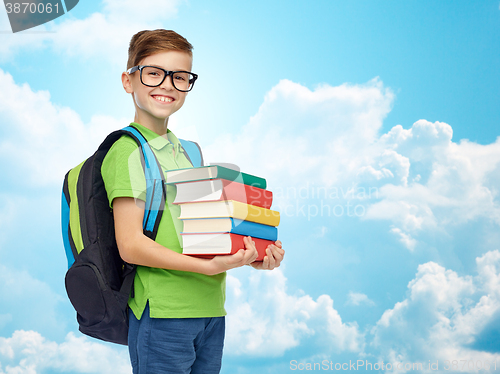 Image of happy student boy with school bag and books