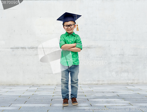 Image of happy boy in bachelor hat or mortarboard