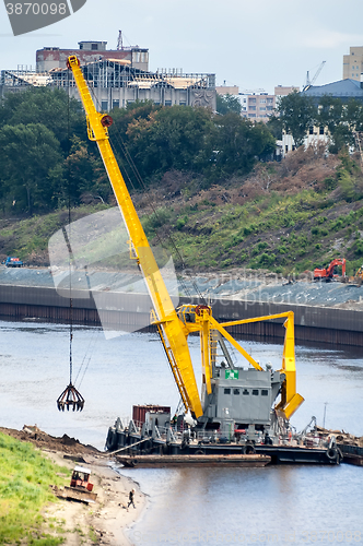 Image of Floating crane extracts sand. Tyumen. Russia