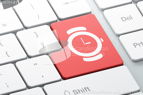 Image of Time concept: Watch on computer keyboard background