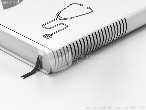 Image of Health concept: closed book, Stethoscope on white background