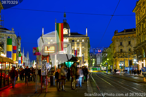 Image of Via Dante shopping street with people at night