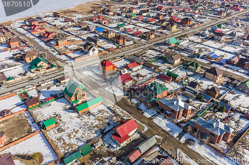 Image of Aerial view on suburban street at spring