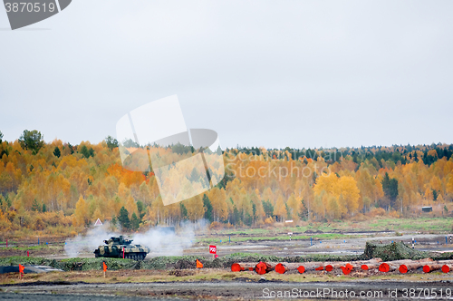 Image of Firing from tank machine gun