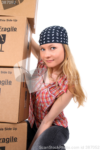 Image of Portrait of a young woman with cardboard boxes