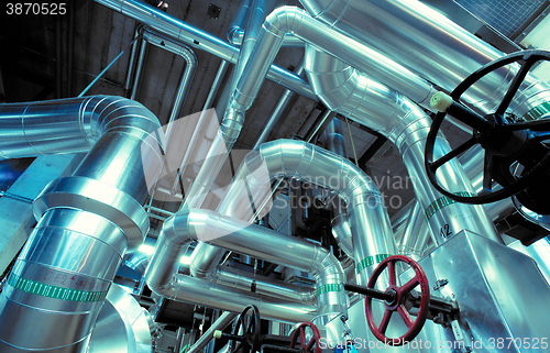 Image of Equipment, cables and piping as found inside of a modern industr