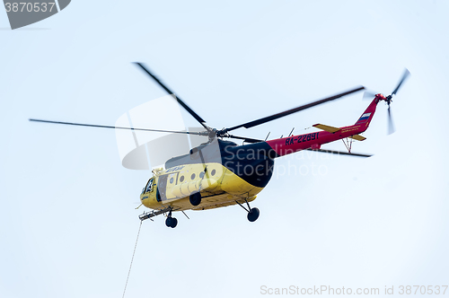 Image of Descent of empty stretcher from MI-8 helicopter