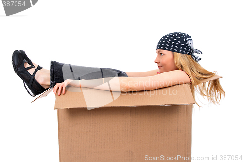 Image of Girl sitting in a cardboard box