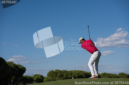 Image of golf player hitting long shot
