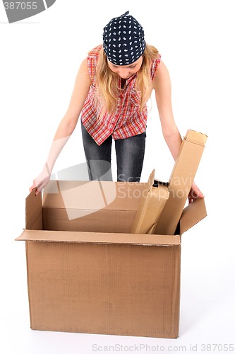 Image of Young woman looking into an open box