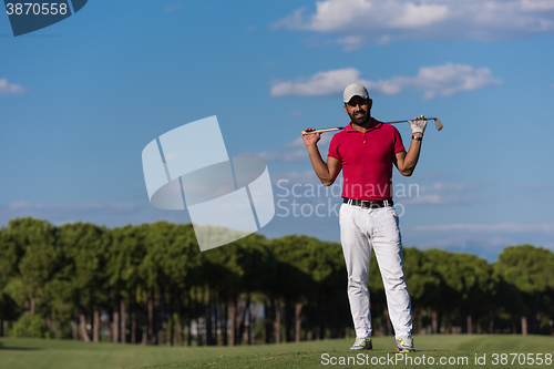 Image of handsome middle eastern golf player portrait at course