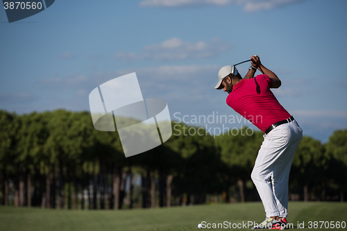 Image of golf player hitting long shot