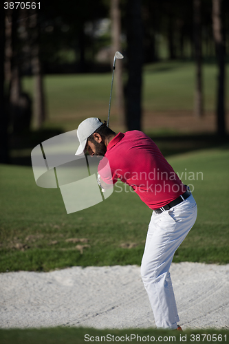 Image of golfer hitting a sand bunker shot