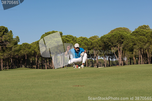 Image of golf player aiming perfect  shot