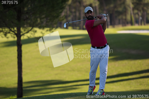 Image of golf player hitting long shot