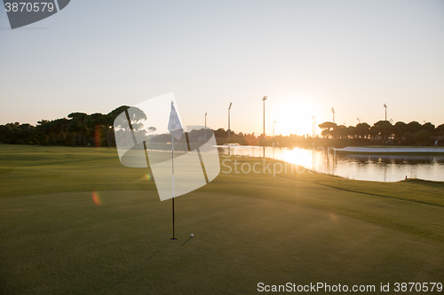 Image of golf ball on edge of  the hole