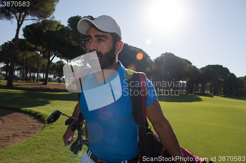 Image of golf player walking