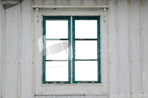 Image of Cut out windowpanes in an old window