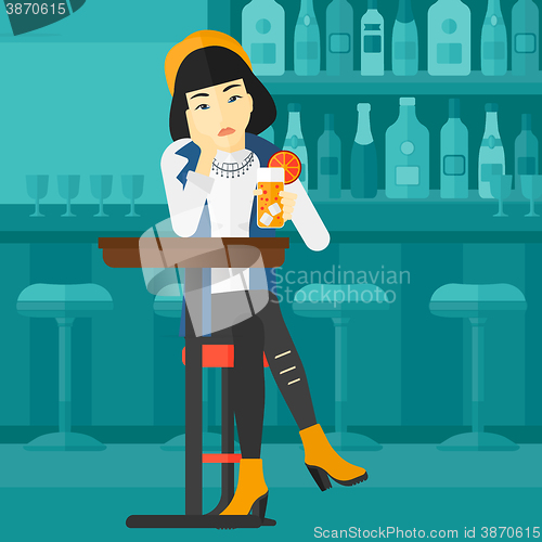 Image of Woman sitting at bar.