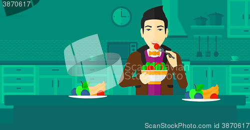 Image of Man eating salad.