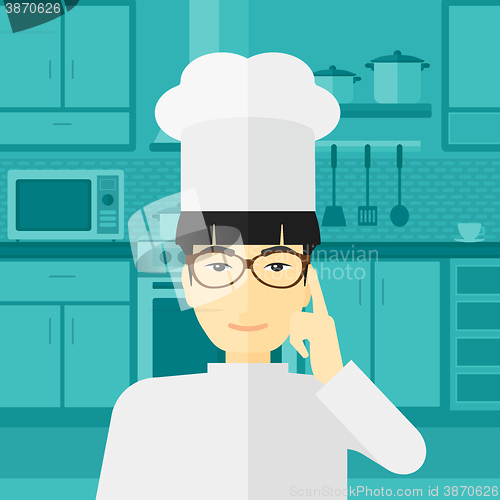 Image of Chef pointing forefinger up.