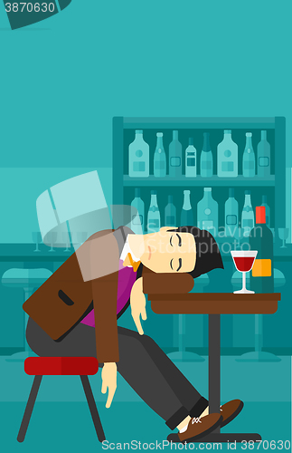 Image of Man sleeping in bar. 