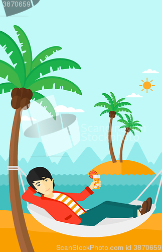 Image of Man chilling in hammock.