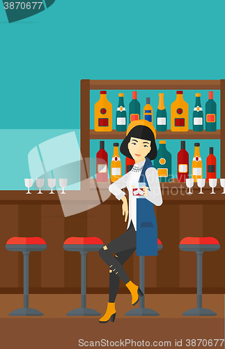 Image of Woman sitting at bar.