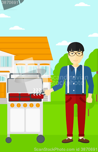 Image of Man preparing barbecue.