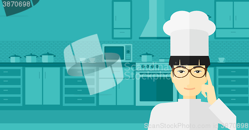 Image of Chef pointing forefinger up.