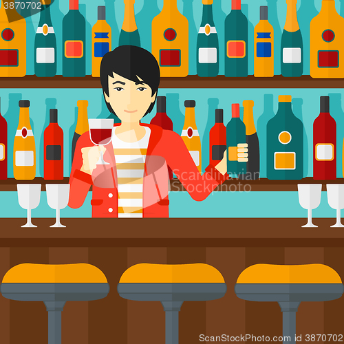 Image of Bartender standing at the bar counter.