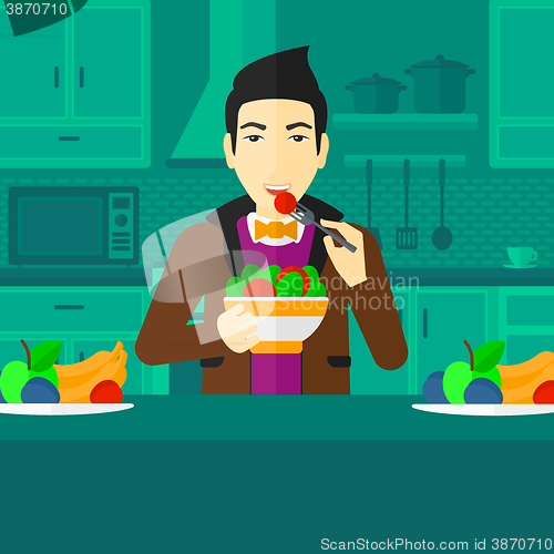 Image of Man eating salad.