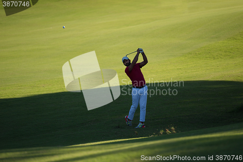 Image of golf player hitting long shot