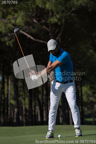 Image of golf player hitting shot