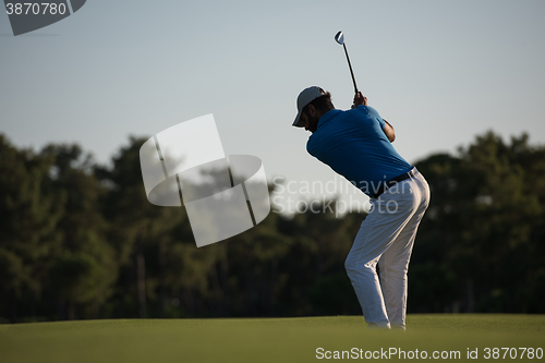 Image of golfer hitting long shot