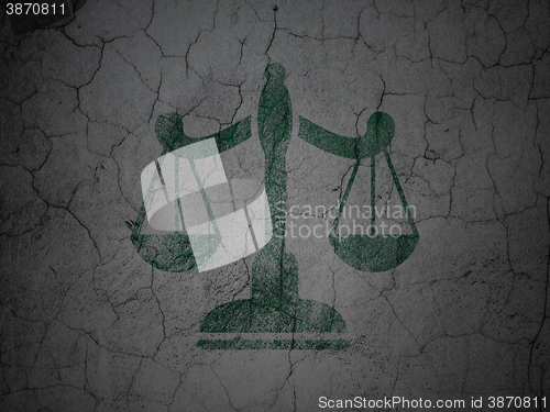 Image of Law concept: Scales on grunge wall background