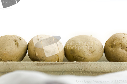 Image of Five raw potatoes