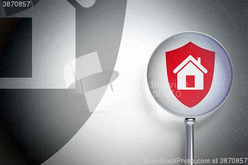Image of Business concept:  Shield with optical glass on digital background