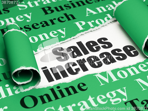 Image of Marketing concept: black text Sales Increase under the piece of  torn paper